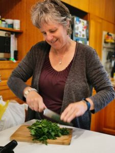 This is me in my kitchen chopping herbs to make my meal more delicious